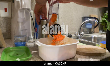 Closeup used vegetable chopper cookware on kitchen table. Stock Photo