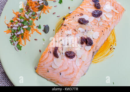 close up salmon steak on a green plate Stock Photo