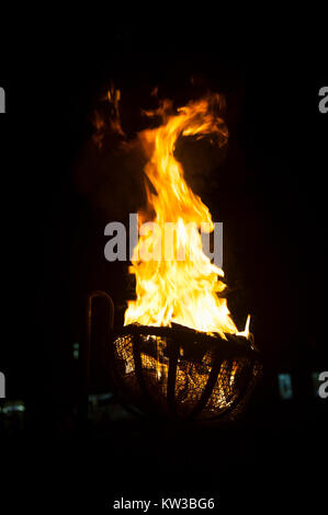 USA Virginia VA Colonial Williamsburg a wood fire in a cresset at night Stock Photo