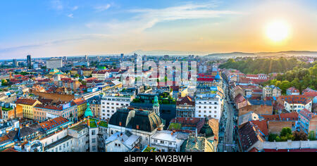 Sunset aerial panorama of Zagreb cityscape, capital city of Croatia and famous winter resort in Europe. Stock Photo