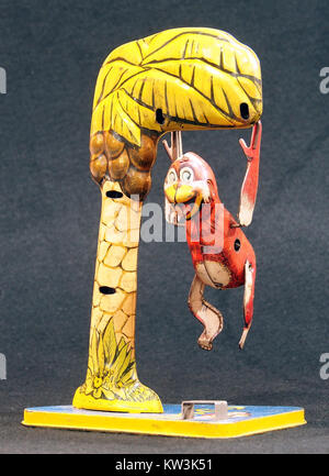 Bombo, tin toy monkey in tree, pic 1 Stock Photo