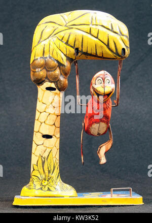 Bombo, tin toy monkey in tree, pic 2 Stock Photo