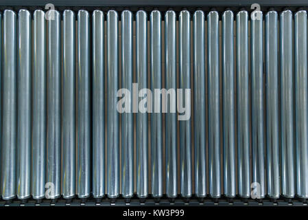 Crossing of the roller conveyor. Crossing of the roller conveyor, Production line conveyor roller transportation objects. Stock Photo