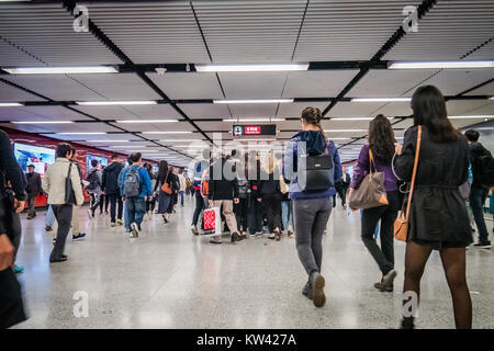 commuters inside a MTR train station in Hong Kong during rush hour Stock Photo