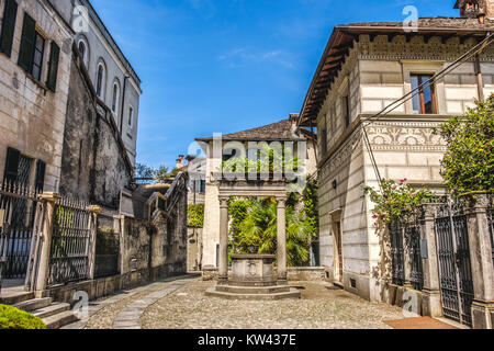 Orta San Giulio court alley water well village pump Piedmont Novara Italy Stock Photo