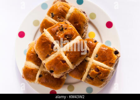 Marks & Spencer Berries & Cherries Hot Cross Buns with raspberries cranberries blackberries and cherries on plate ready for Easter Stock Photo