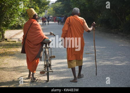 Two Elderly Monks walking on the street Stock Photo
