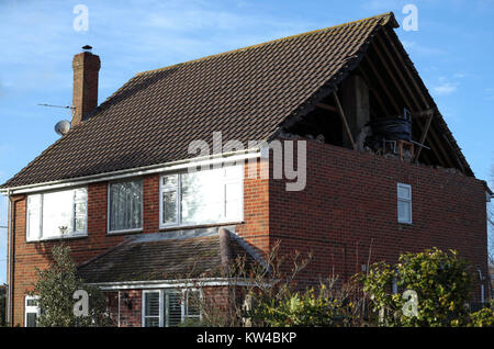 A view of damage to the gable end of a house in East Boldre, Hampshire, after strong winds hit on Friday. Stock Photo