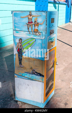Artwork depicting surfers on an electrical box on a sidewalk in Pismo Beach, California, a beachside community on California's central coast. Stock Photo