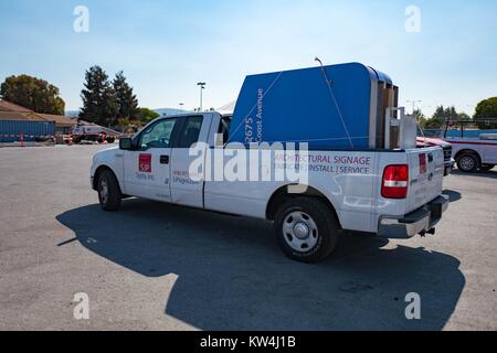 Pickup truck belonging to SJP Signs Inc (San Jose Plastics and Neon Sign Company), with newly-manufactured signs for financial software company Intuit waiting to be installed at the company's headquarters in the Silicon Valley town of Mountain View, California, August 24, 2016. Stock Photo