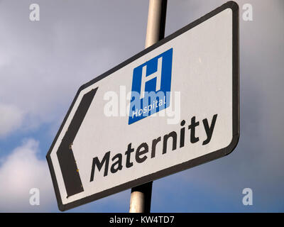 A close up of a road direction sign pointing traffic to the maternity unit of a hospital Stock Photo