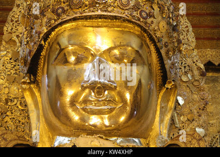 Face of golden Mahamuni Buddha statue in Mandalay, Myanmar Stock Photo
