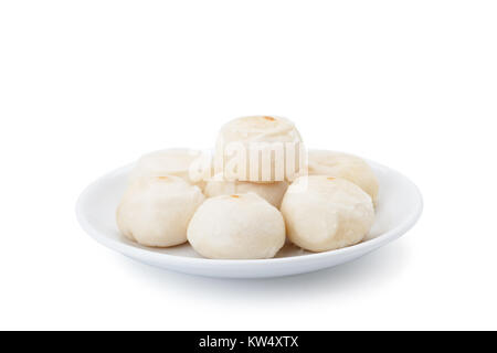 Chinese pastry with salted egg in white ceramic plate isolated on white background with clipping path and soft shadow Stock Photo
