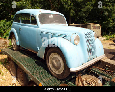 A retro, vintage car, often referred to as an oldtimer, is captured in ...