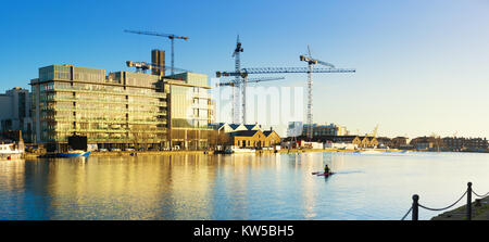 DUBLUN, IRELAND- February 4, 2017: Modern part of Dublin Docklands or Silicon Docks, construction of a new office block on a brigh morning, panoramic Stock Photo