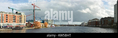 DUBLUN, IRELAND- February 4, 2017: Modern part of Dublin Docklands or Silicon Docks, construction of a new office block on a brigh morning, panoramic  Stock Photo