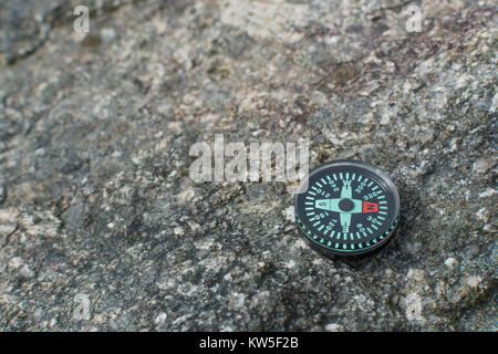 Button compass - metaphor business 'direction', navigation, moral compass, getting your bearings concept, orienteering - with copy space. Stock Photo