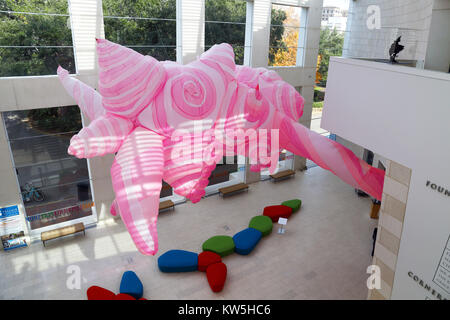 A large inflatable installation piece by artist Anne Ferrer hangs from the cieling of the Jepson Center Eckburg Atrium in Savannah Georgia. Stock Photo