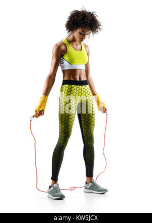 Young girl with skipping rope on white background. Resting time. Best cardio workout Stock Photo