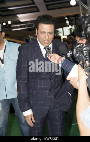 Tampa, FL - April 24: GOVINDA poses on the green carpet at the Tampa Convention Center ahead of IIFA Rocks on the second day of the 15th International Indian Film Academy (IIFA) Awards in Tampa, Florida, April 24, 2014.   People:  GOVINDA Stock Photo