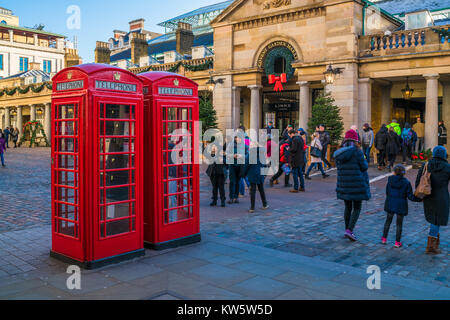 LONDON DECEMBER 28, 2017:  Two iconic telephone boxes in Covent Garden, a district of Westminster in Greater London which is a popular shopping and to Stock Photo