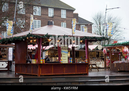 A German Christmas market in Greenwich, London on a wet and grey December day Stock Photo