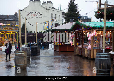 A German Christmas market in Greenwich, London on a wet and grey December day Stock Photo