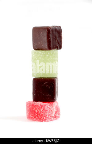 Colored Sweet jellies and chocolate bonbons on white bakground, image of a Stock Photo