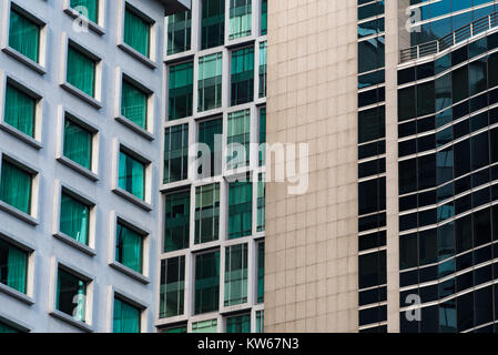 three different high rise towers built very close together in Kuala Lumpur, Malaysia Stock Photo