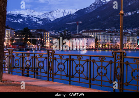 the elegant facades of the buildings of Lugano, Switzerland, illuminated in a winter evening Stock Photo