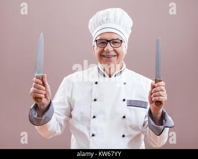 Portrait of happy restaurant's chef in working uniform Stock Photo