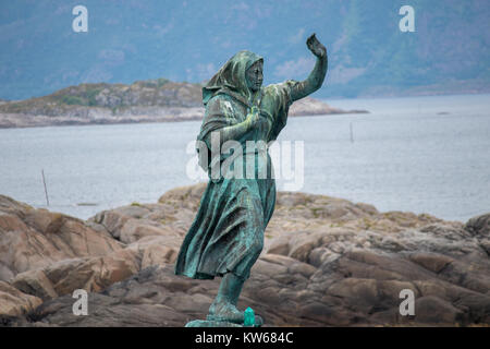 SVOLVAER, NORWAY - JULY 12, 2017: The statue 'Fisherman's wife' at the harbour entrance, Svolvaer, Lofoten Islands, Nordland county, Norway. Stock Photo