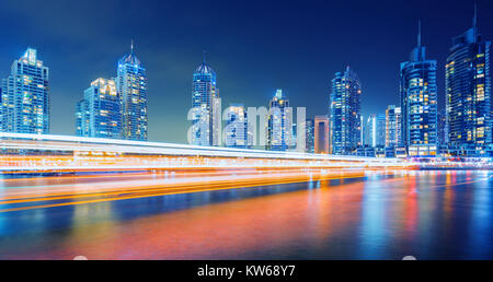 Evening on busy canal and promenade in Dubai Marina,Dubai,United Arab Emirates