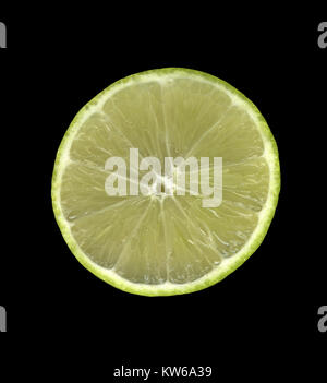 Bearss lime cut in half on black background Stock Photo