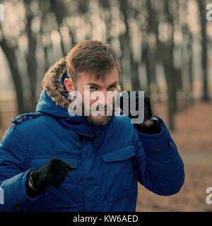 Bearded Businessman Aggressively Gesticulates. Bearded Man. Man Is Showing A Fist. Stock Photo