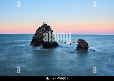 Japan, Honshu island, Ise Shima, Mie region, Futami, Meoto-Iwa (Wedded Rocks), two rocks considered to be male and female, joined in matrimony by shim Stock Photo