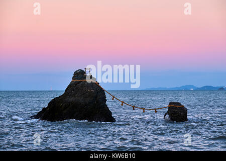 Japan, Honshu island, Ise Shima, Mie region, Futami, Meoto-Iwa (Wedded Rocks), two rocks considered to be male and female, joined in matrimony by shim Stock Photo