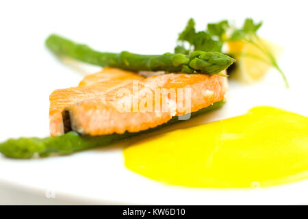 Salmon and aspargus shot with lemon, dill garnish with shalow depth of field Stock Photo