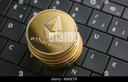 ethereum coins stack cryptocurrency, digital money on computer keyboard Stock Photo