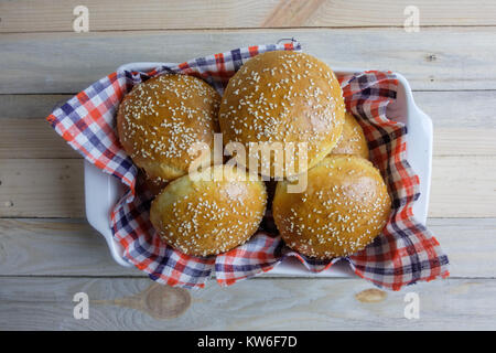Homemade burger bun on plate Stock Photo