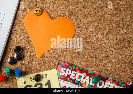 Blank Heart shaped Note on cork notice board Stock Photo