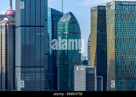 Modern Shanghai Skyline - A closeup view of colorful modern glass and steel buildings and skyline with sunny blue sky in Lujiazui, Shanghai, China. Stock Photo