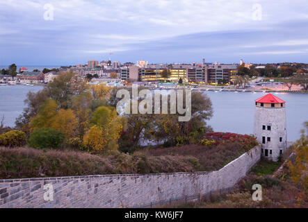 The West Martello Tower at Fort Henry with the Kingston skyline and the Royal Military College of Canada in Kingston, Ontario, Canada. Stock Photo