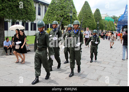 Soldiers walk inside territory of Grand palace in Bangkok, Thailand Stock Photo