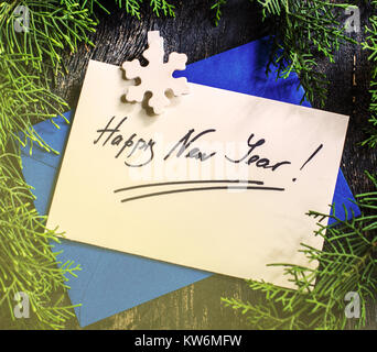 Gift boxes and cards for Christmas celebration with festive decorations on rustic wooden backgroubd with copyspace Stock Photo