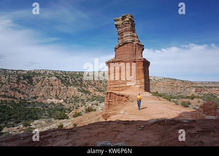 Hiker at the Lighthouse hoodoo of the Palo Duro Canyon State Park of Texas. Stock Photo