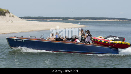 SOUTHAMPTON, NY - AUGUST 16: TV Personality Khloe Kardashian, Mason Disick, Scott Disick and friends head on out for a day of tubing on their boat while in the Hamptons for the Summer. Khloe and Scott are in town filming reality show 'Kourtney and Khloe take on the Hamptons.' on August 16, 2014 in Southampton, New York  People:  Khloe Kardashian, Mason Disick, Scott Disick Stock Photo