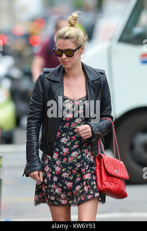 Nicky Hilton wears a floral print summer dress accessorized with a silver Chanel  handbag while out and about in New York City Featuring: Nicky Hilton Where:  New York City, New York, United