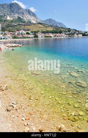 Adriatic sea at Podgora in Croatia with crystal clear sea and mountain Biokovo in background Stock Photo
