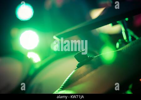 Electronic drum set with cymbals and blurred stage lights on a background Stock Photo